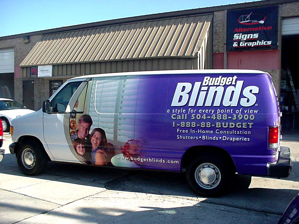 Installation of vehicle wrap and lettering on Budget Blinds van